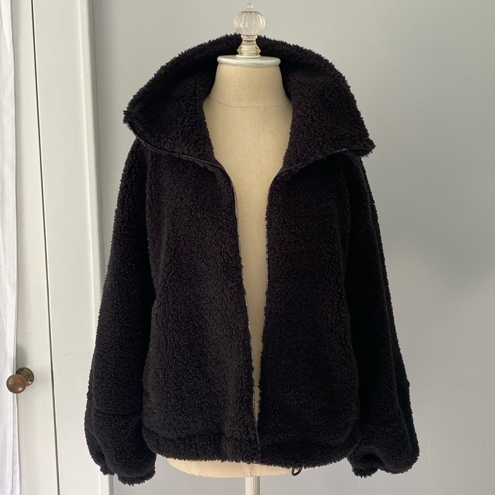 Zippered black teddy coat with soft jersey lining